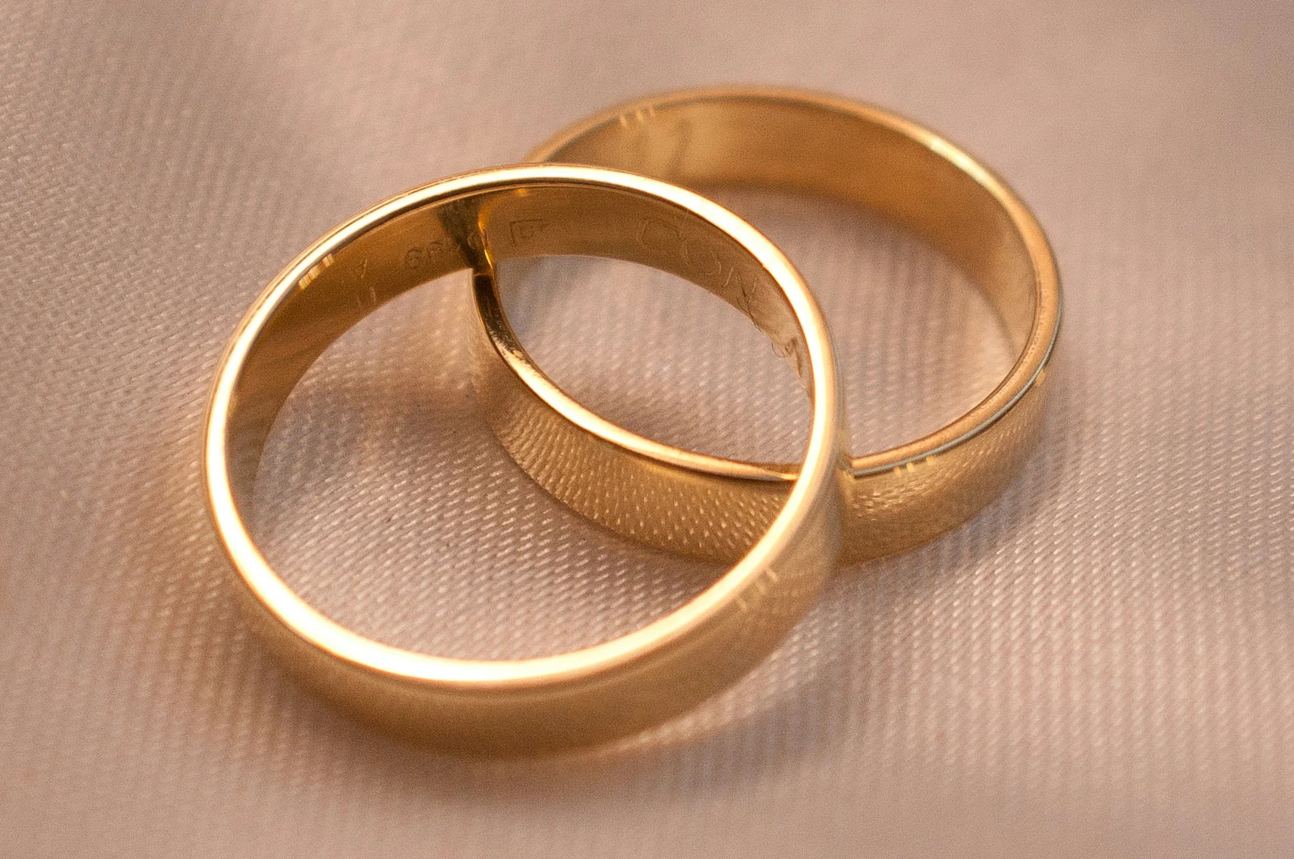 Latitude — Court-profile bands turned from a single bar so the colour matches, then engraved inside by hand before sizing.