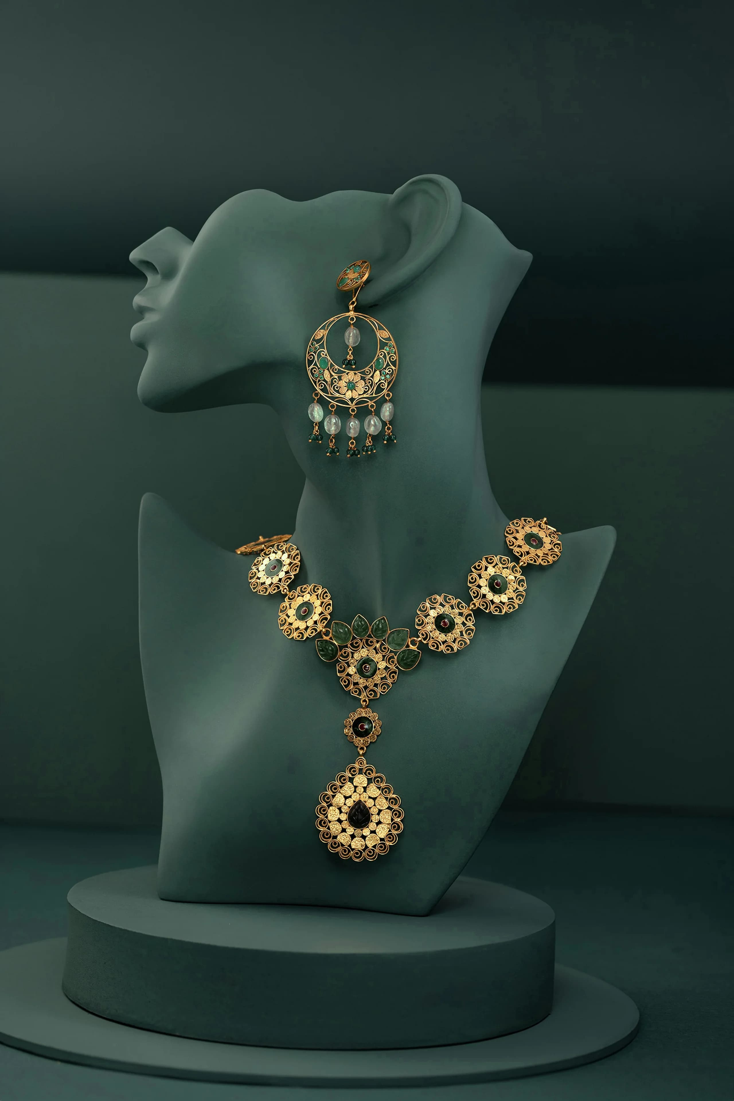 Verdure — Seven filigree medallions, carved tourmaline leaves and a drop that swings free. The ear-drop is sold with it or alone.