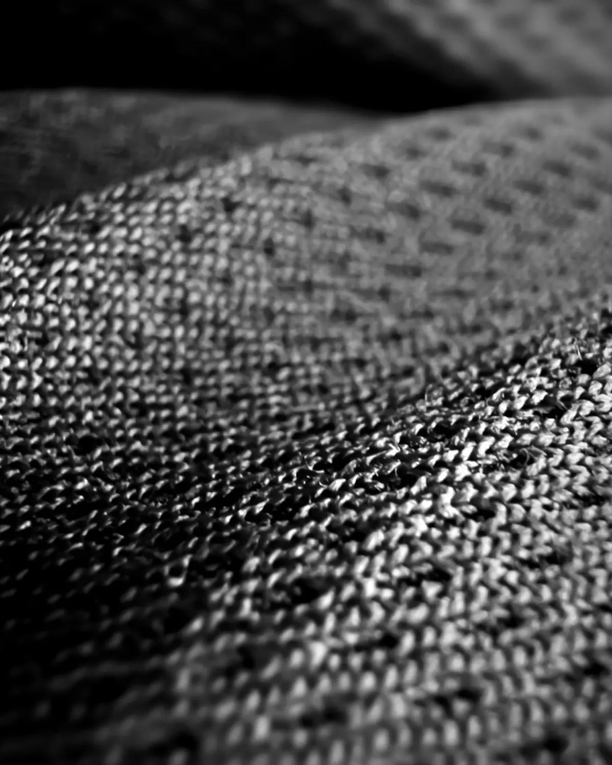 Knit mesh upper raking through studio rim light