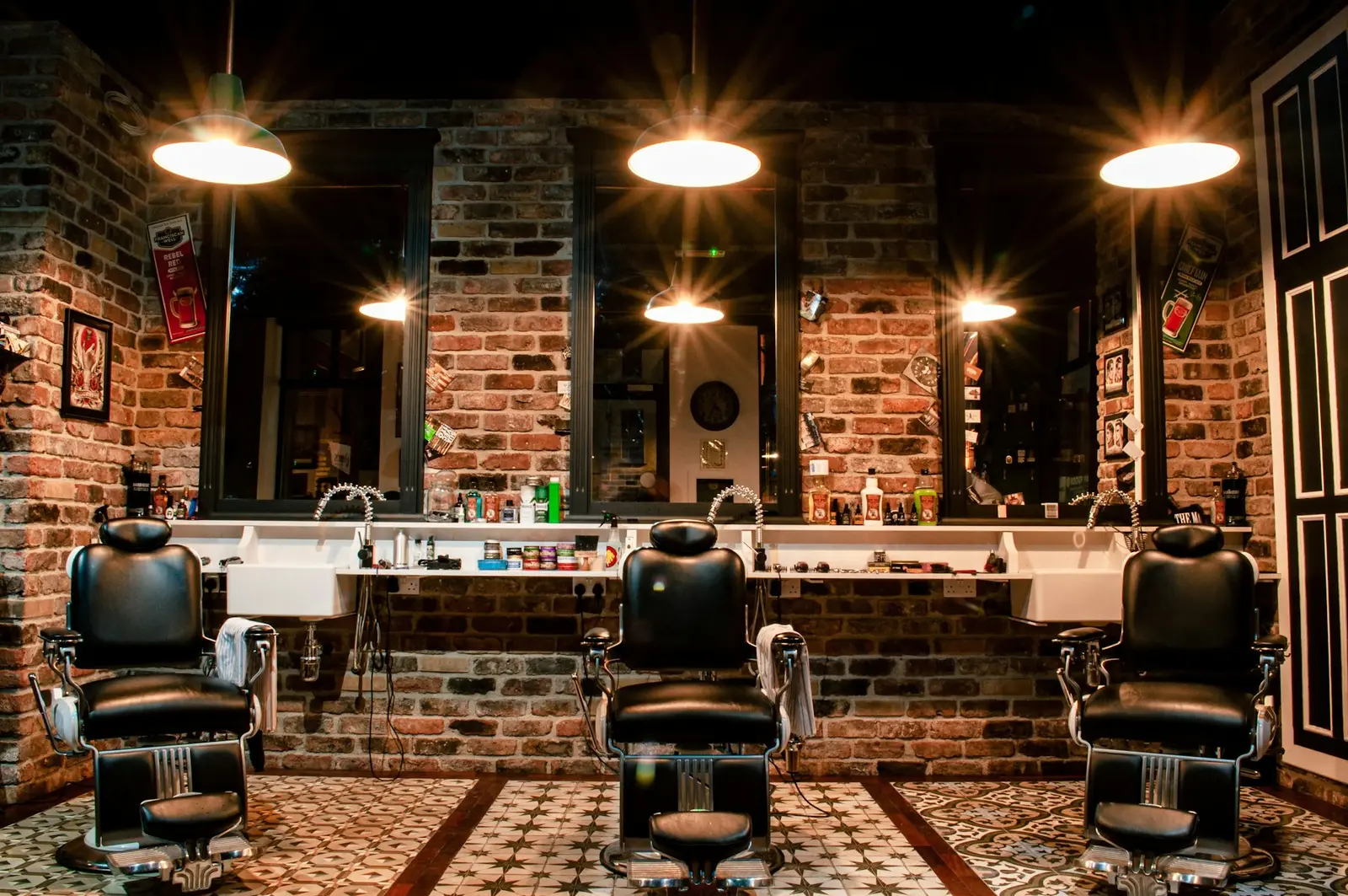 A barbershop with the lights on and no one inside